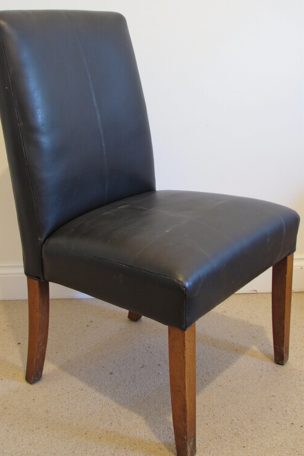 Neutral upholstered dining chairs - Lived-In Charcoal Dining Chair: Comfortable & Welcoming - Charcoal gray dining chair: One comfy chair, showing...