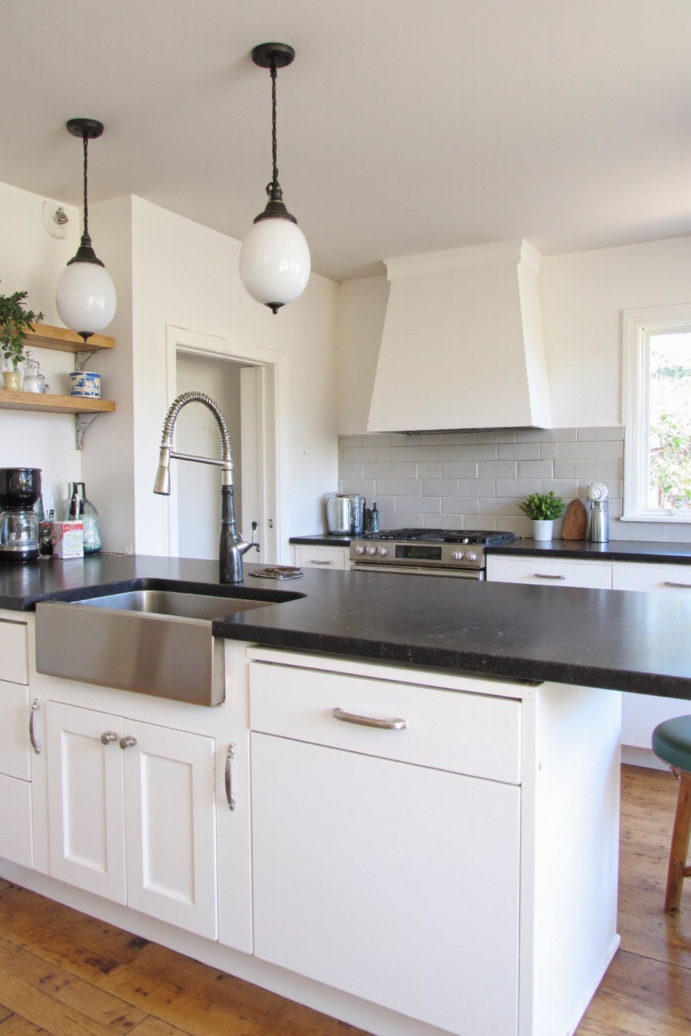 Black and White Modern Kitchen - Modern White Kitchen: Black Breakfast Bar & Island - Sleek white kitchen with a black breakfast bar...