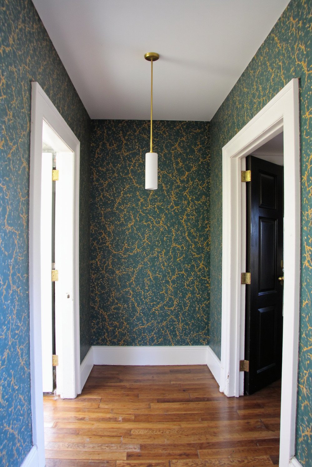 Narrow hallway decor ideas - Geometric Wallpaper: Brighten a Dark Narrow Entryway - Make a dramatic statement in a long, narrow...