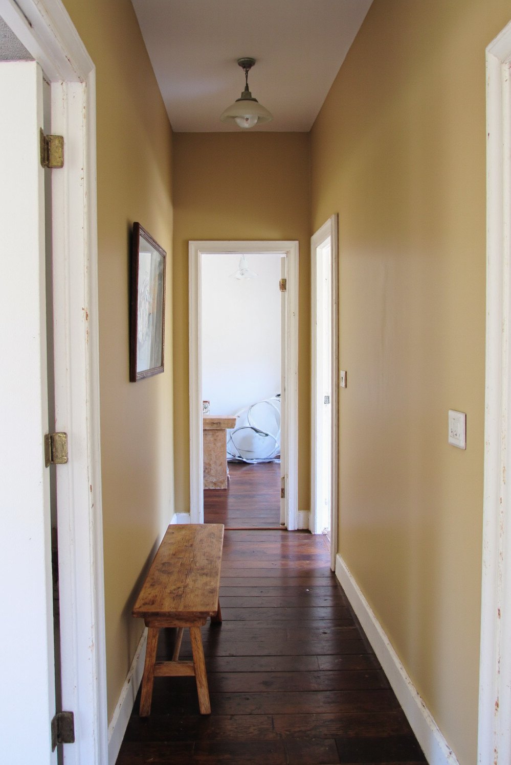 Narrow hallway decor ideas - Rustic Charm: Decorating a Long Narrow Hallway - Narrow hallway? No problem! I love this rustic...