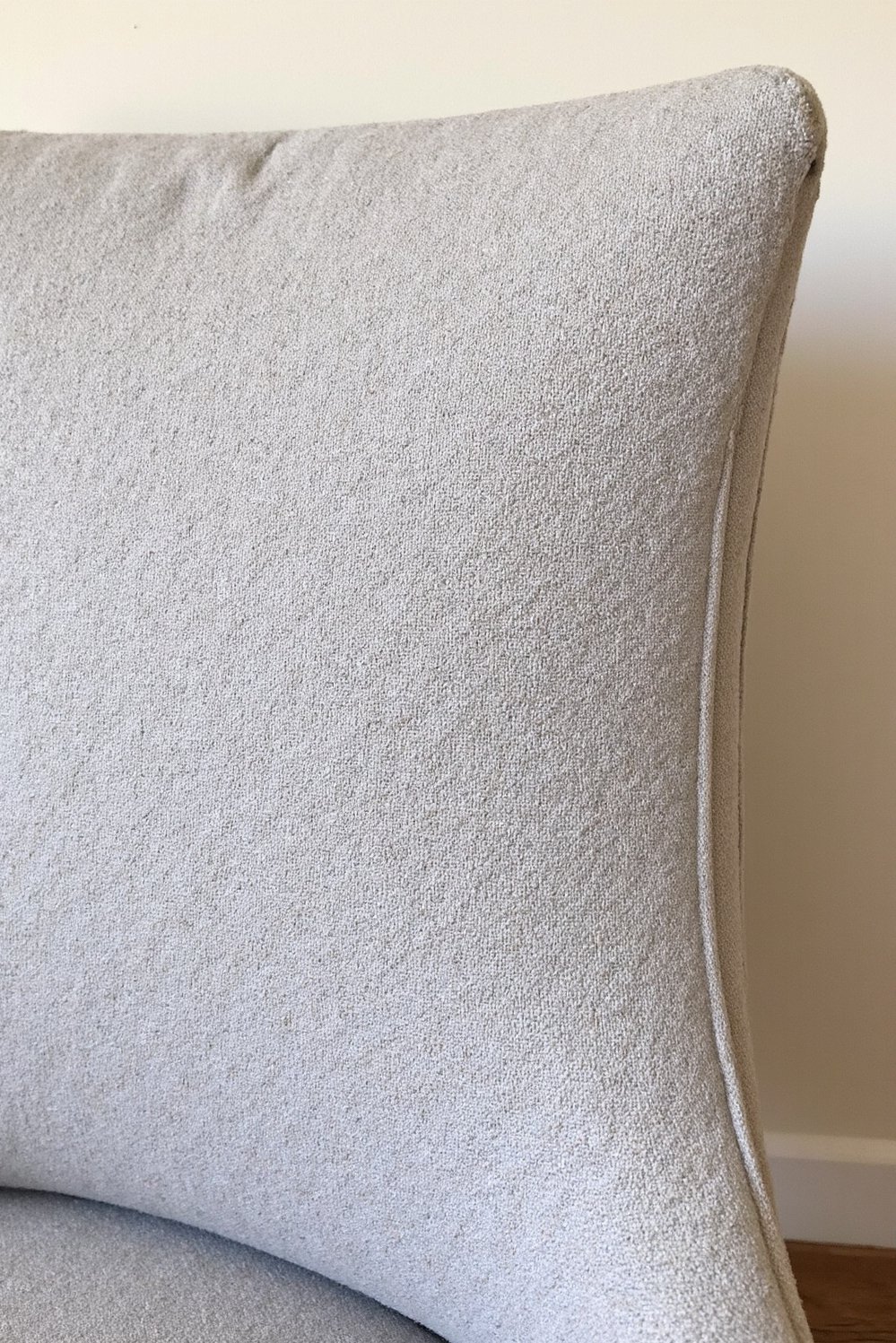 Neutral upholstered dining chairs - Subtle Stitching: High-Quality Gray Linen Dining Chair - Close-up of exquisite stitching on a light gray...