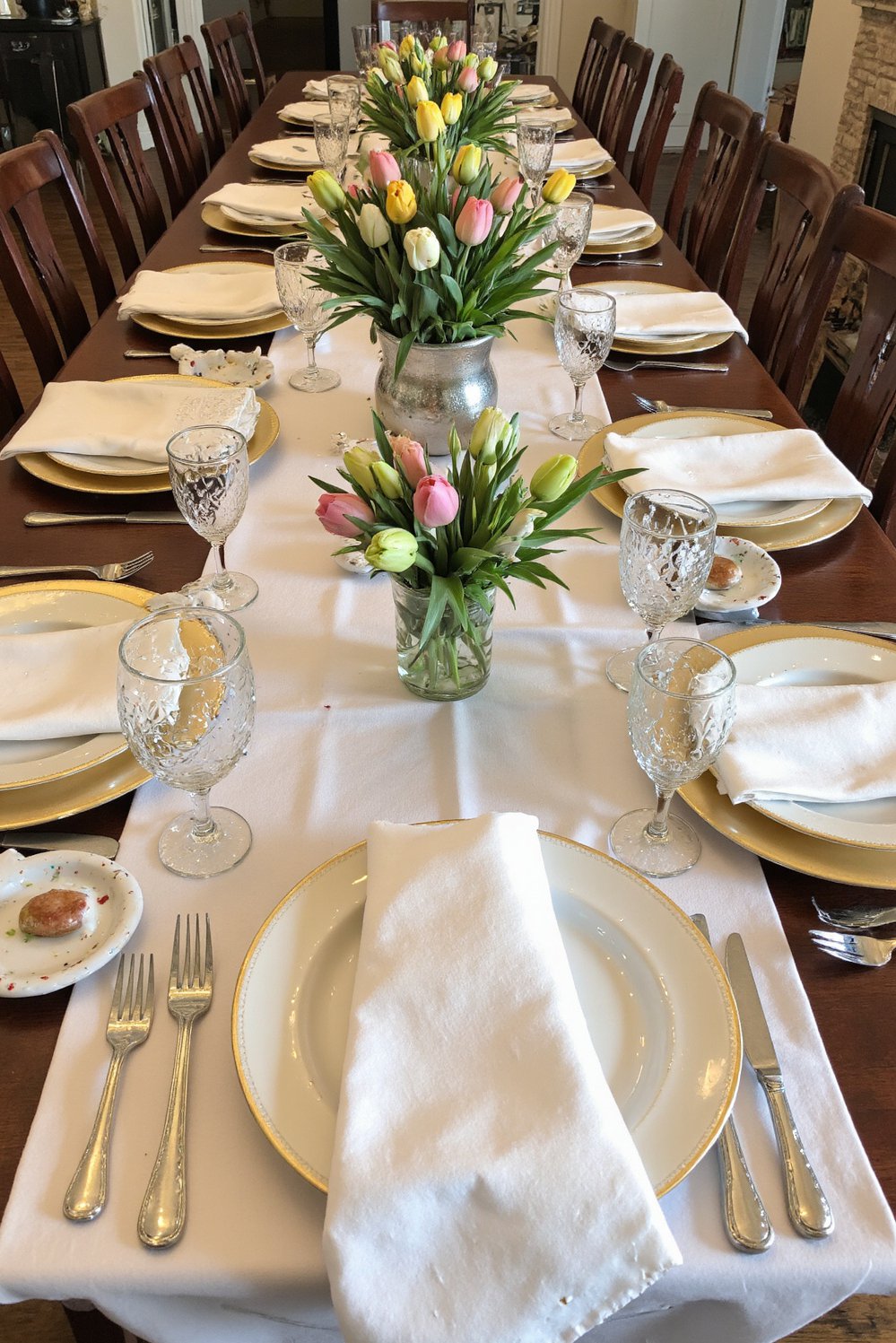 Spring Tablescapes ideas - Elegant Easter Tablescape: White Linen & Pastel Tulips - Elegant Easter tablescape ideas using a long white...