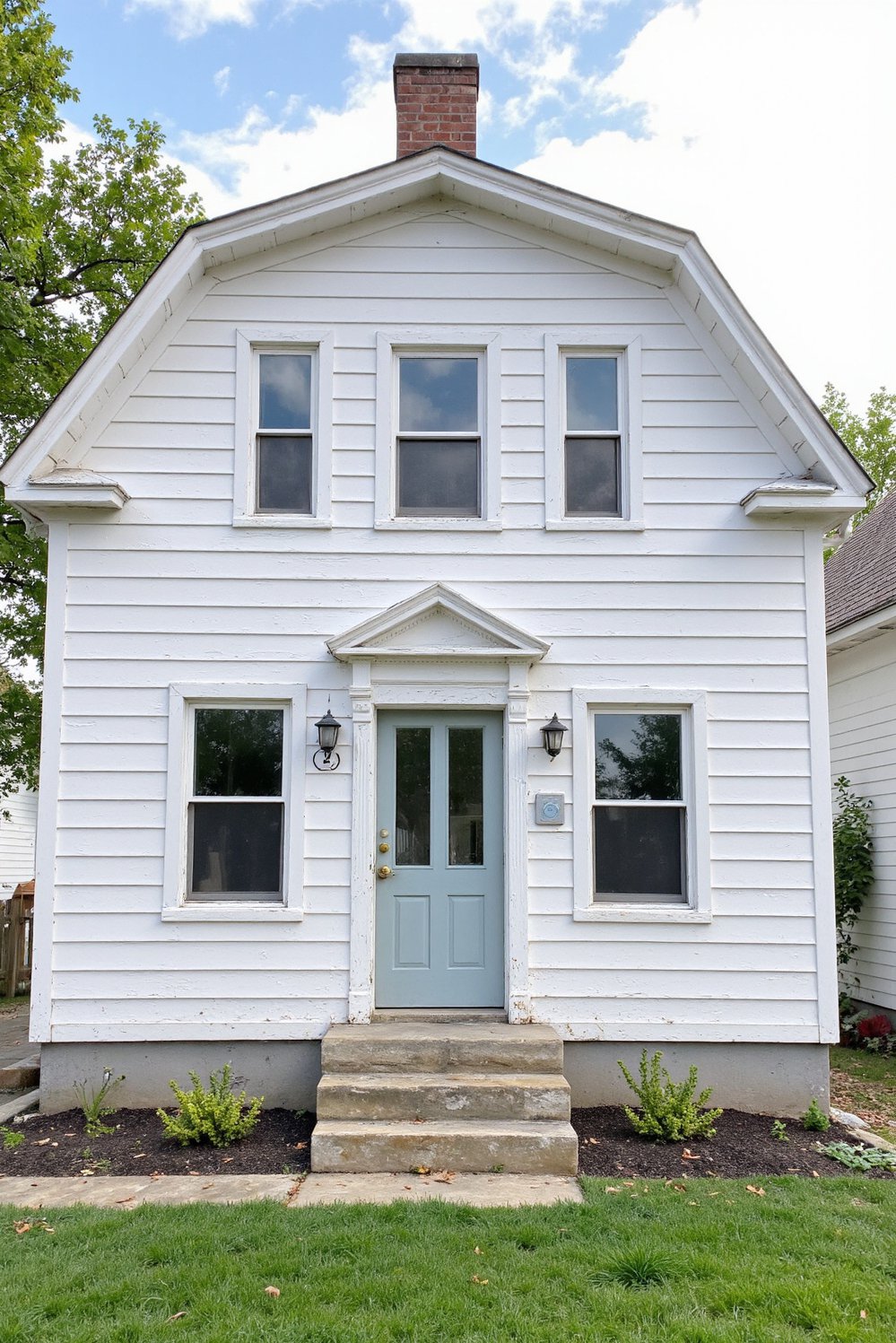 Modern Farmhouse Color Palette - Modern Farmhouse Exterior: Grey & White Paint Scheme - This renovated farmhouse showcases a stunning modern farmhouse...