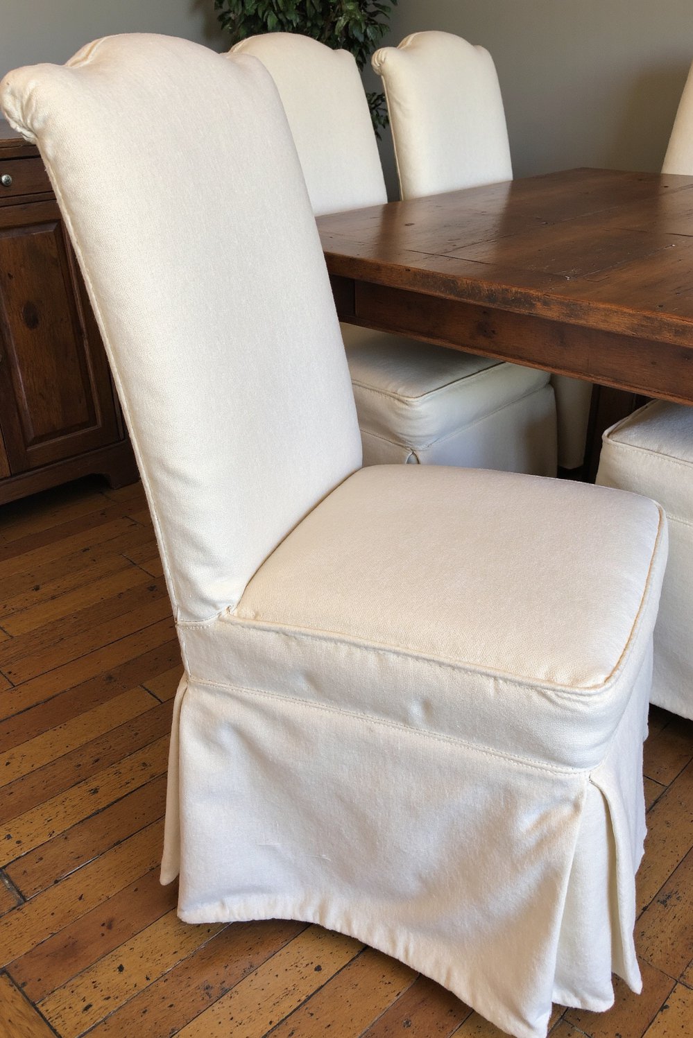 Neutral upholstered dining chairs - Cream Linen Dining Chairs: Rustic Table Setting - Cream linen dining chairs add warmth and texture...