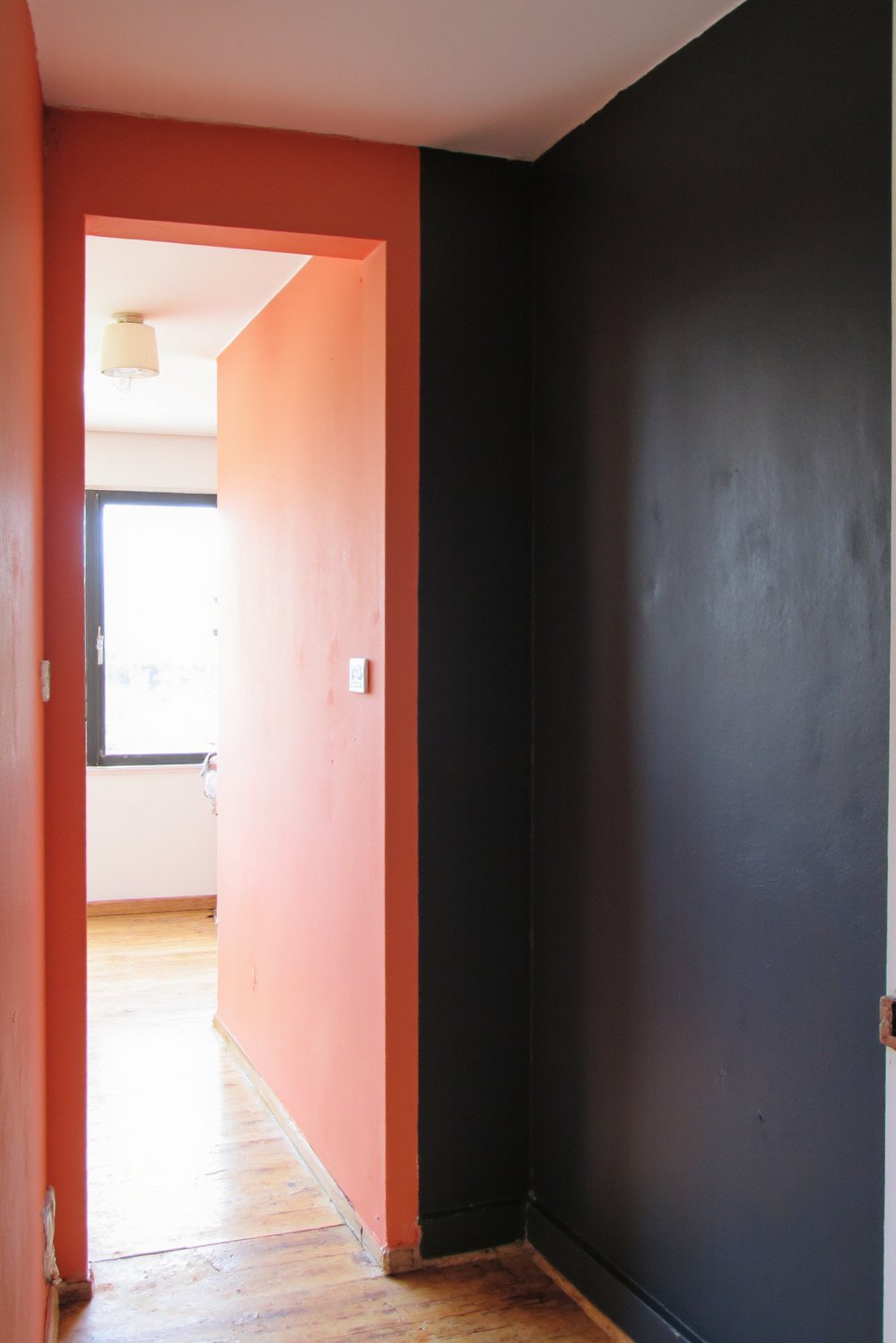 Narrow hallway decor ideas - Dramatic Two-Tone Hallway: Coral & Charcoal Walls - Make a statement with a two-tone hallway! I...