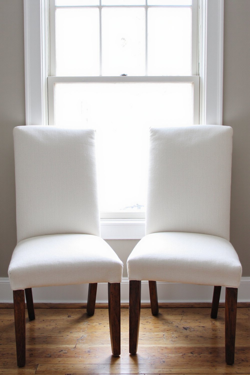 Neutral upholstered dining chairs - Neutral Upholstered Dining Chairs: Elegant Dining Room Design - Neutral upholstered dining chairs: Two off-white linen chairs...
