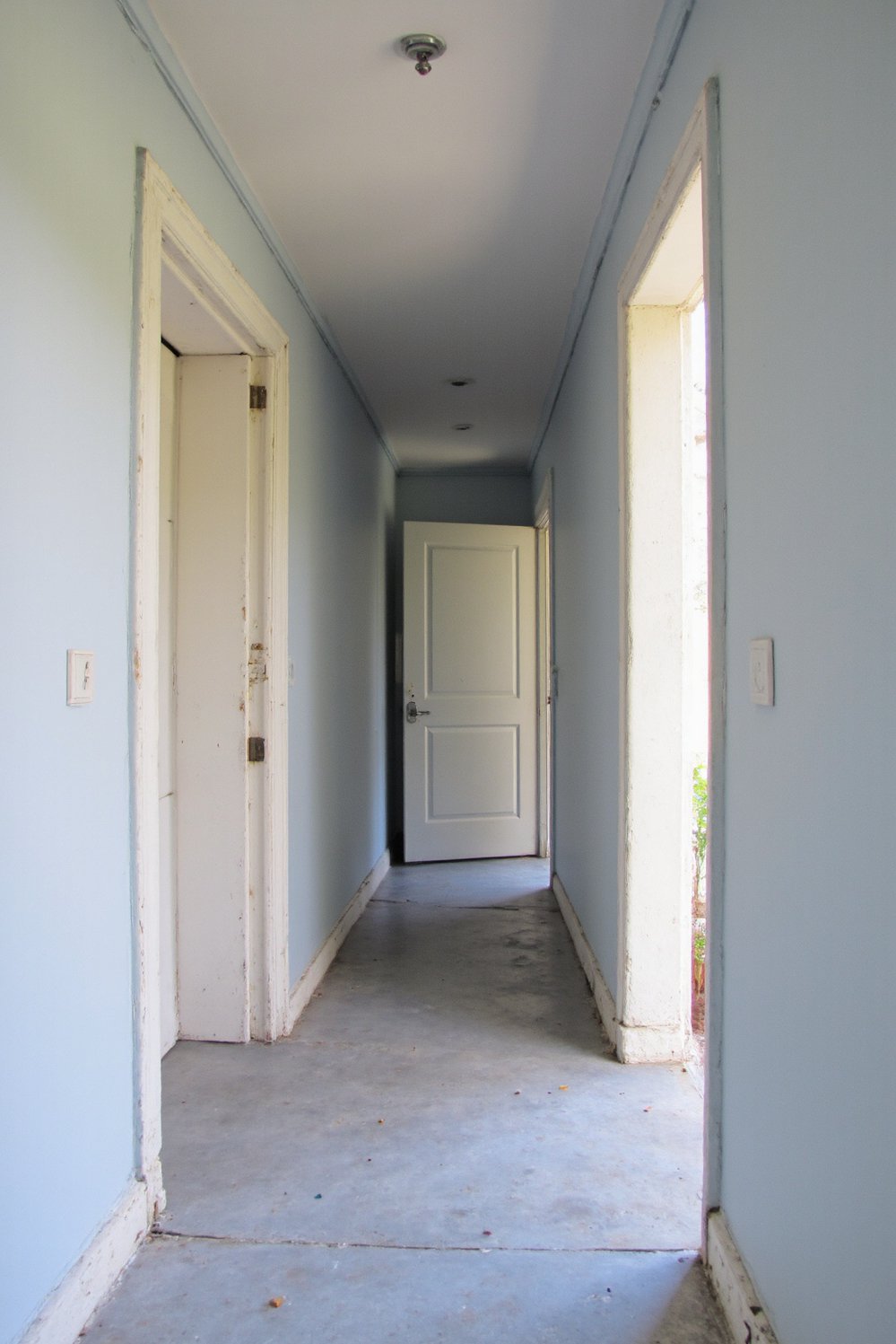 Narrow hallway decor ideas - Serene Light Blue Hallway: Decorating a Narrow Space - Light blue walls instantly calm a narrow hallway....