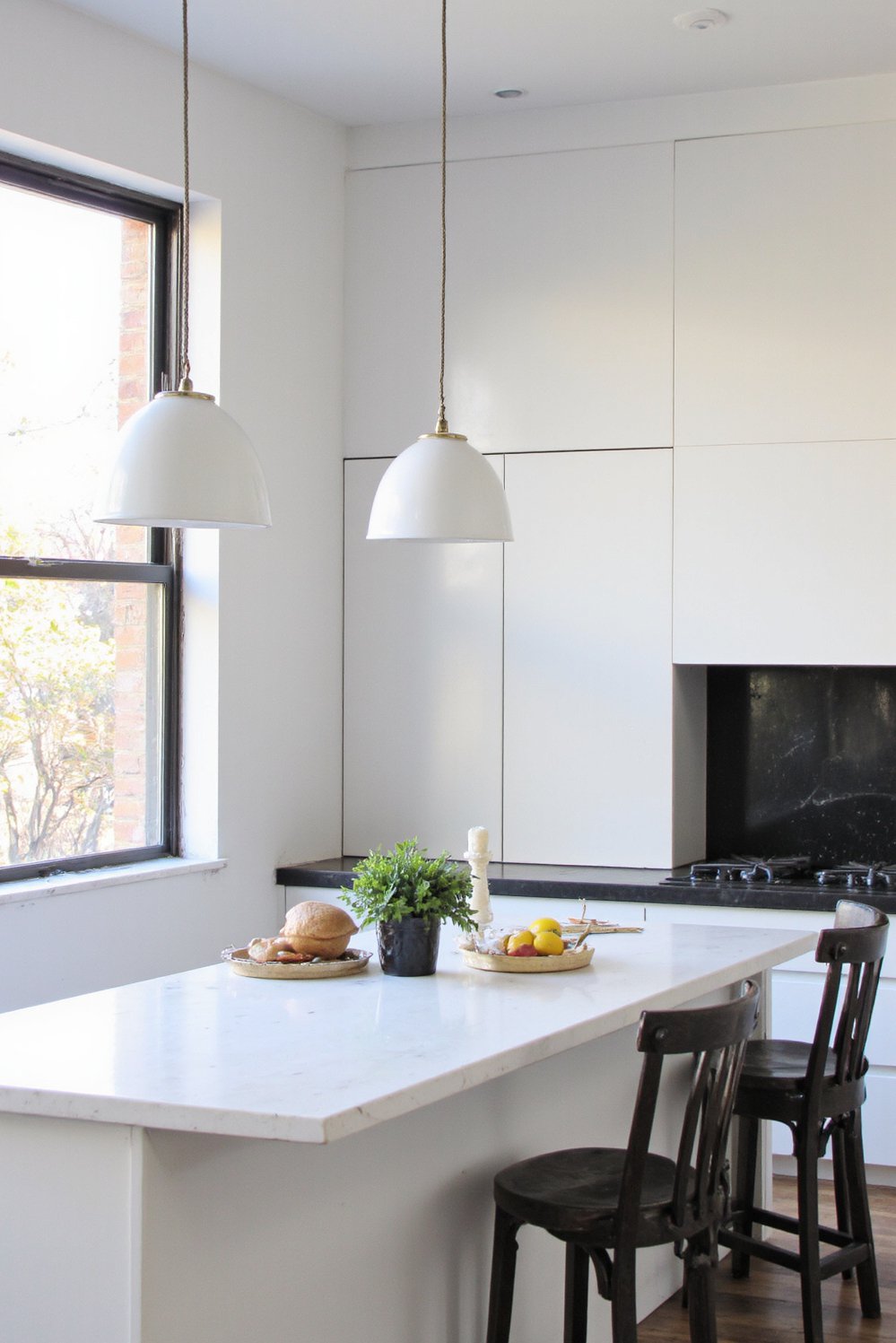 Black and White Modern Kitchen - Sleek Black & White Modern Kitchen: Maximized Light - Sleek black and white modern kitchen. Large windows...