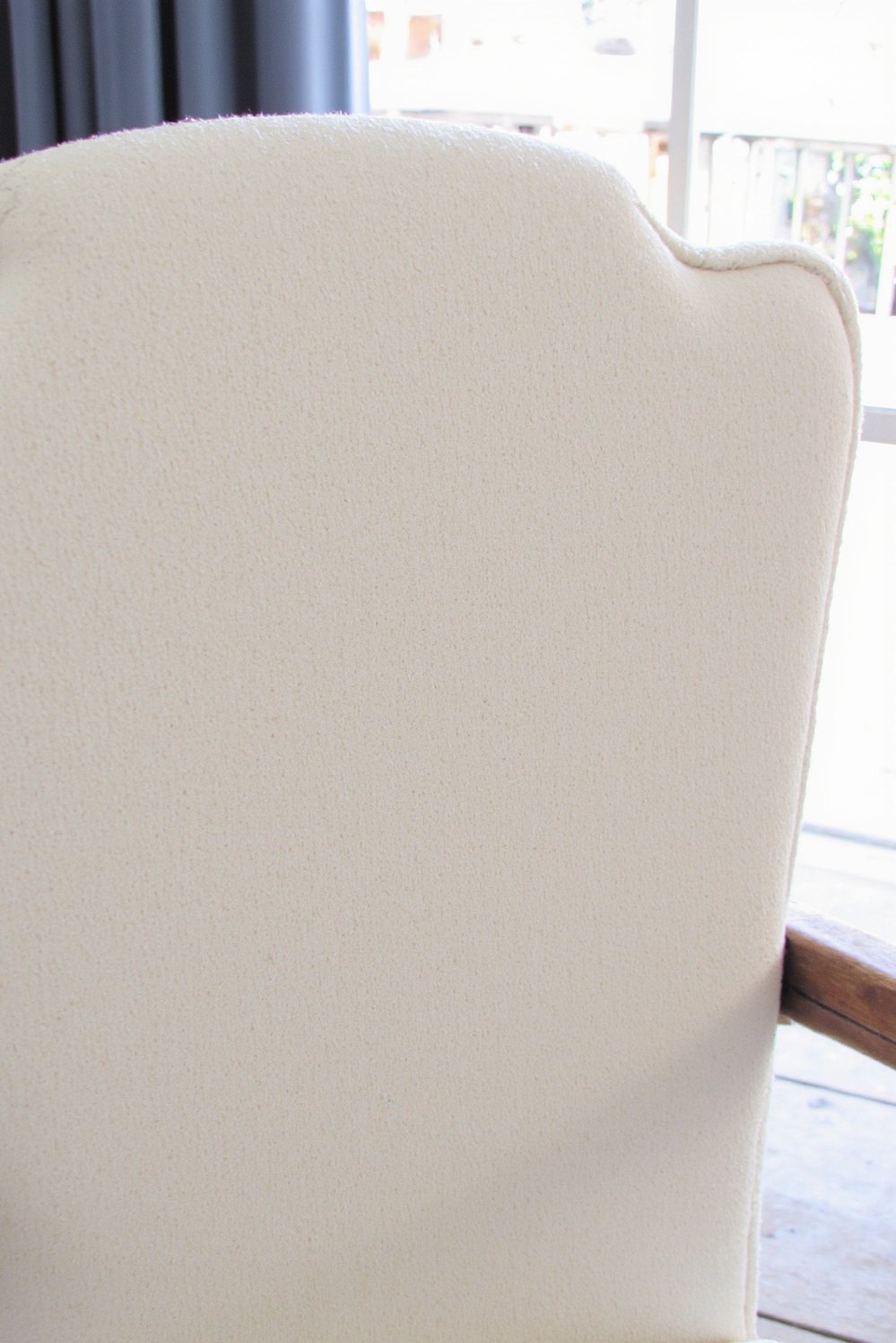 Neutral upholstered dining chairs - Neutral Boucle Dining Chairs: Refined Texture & Style - Neutral dining chairs: A creamy boucle chair, shown...