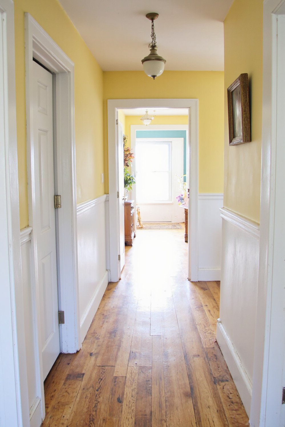 Narrow hallway decor ideas - Brighten a Dark Hallway: Two-Tone Cottage Style - Brighten a dark hallway! Light wood floors and...