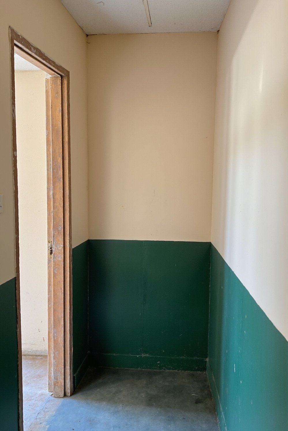 Narrow hallway decor ideas - Two-Tone Magic: Brighten a Long Narrow Hallway - Love this two-tone hallway! Deep green lower walls...