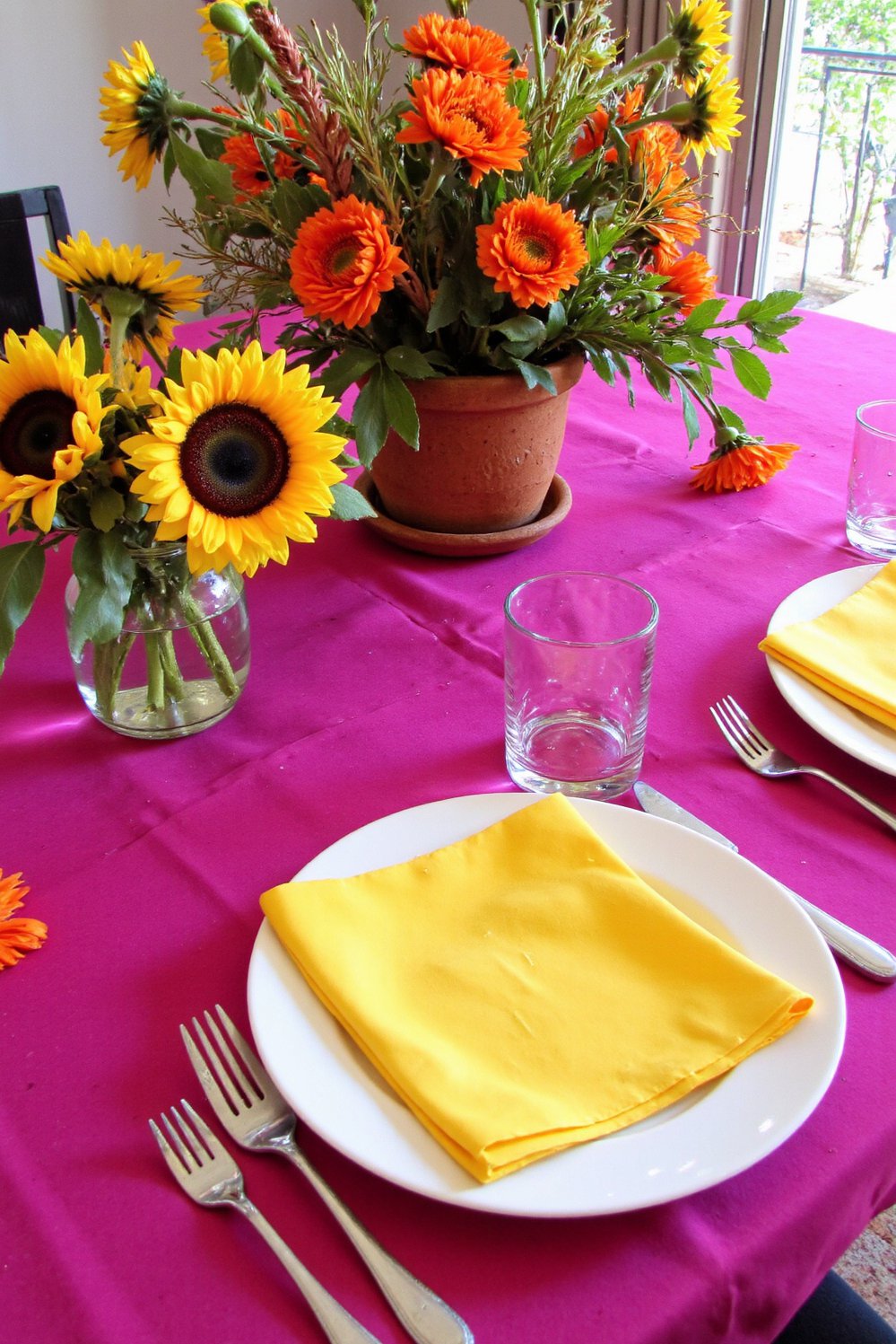 Spring Tablescapes ideas - Bold Spring Tablescape: Fuchsia, Sunflowers & Joy - Bright spring tablescape ideas! A fuchsia tablecloth is...