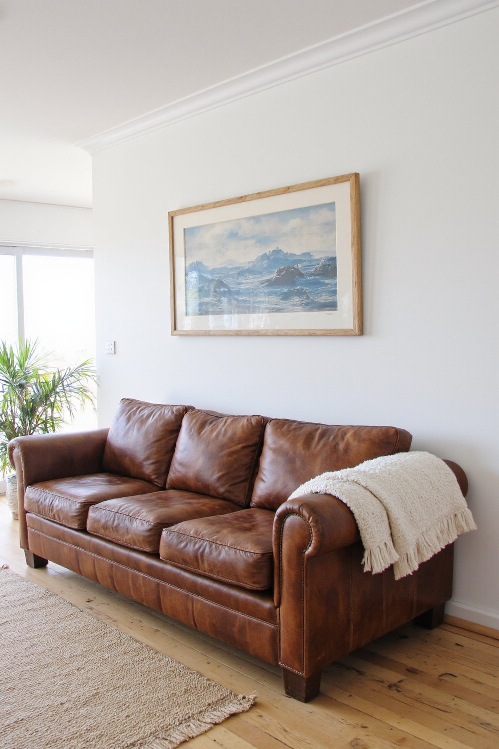 beachy living room ideas - Rustic Coastal Living Room with Leather Couch - Beach house living room with a leather couch:...