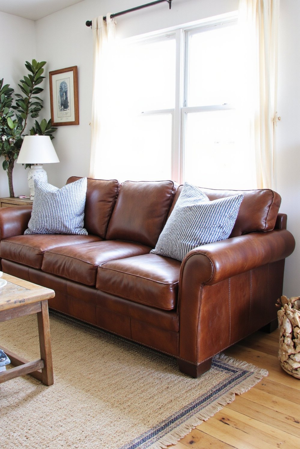 beachy living room ideas - Rustic Leather Couch in a Coastal Living Room - Coastal living room with a leather couch: Rustic...