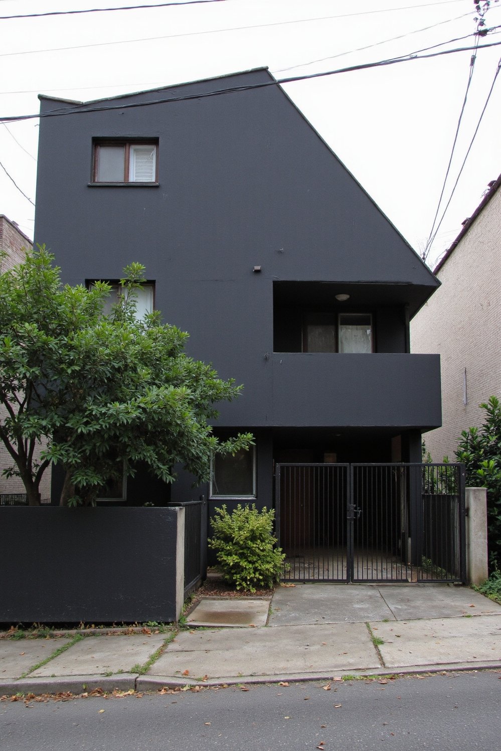 Modern house exteriors - Minimalist House: Dark Interiors, Urban Sanctuary - Modern minimalist house exterior. Clean lines and dark...