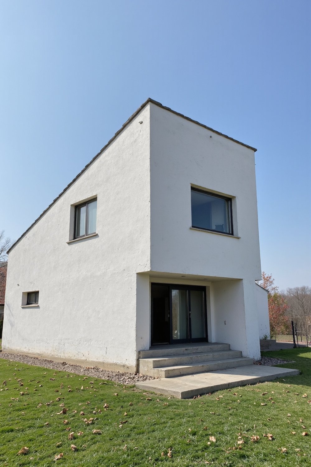 Modern house exteriors - Bold Angular Roofline: Modern Minimalist House - Modern home with a striking angular roof. The...