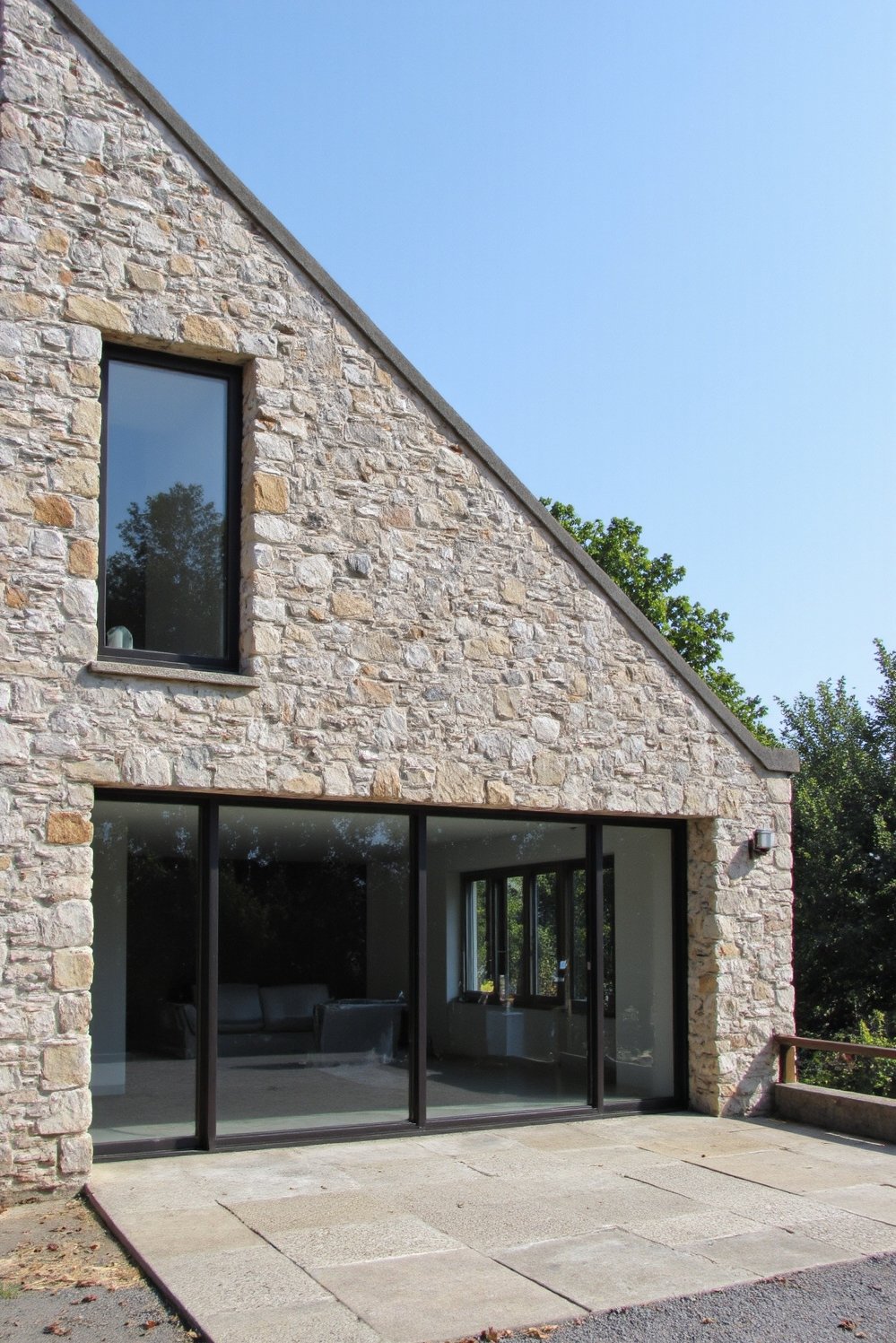 Modern house exteriors - Minimalist House Exterior: Striking Stone and Glass - Modern minimalist house exterior: Natural stone and large...