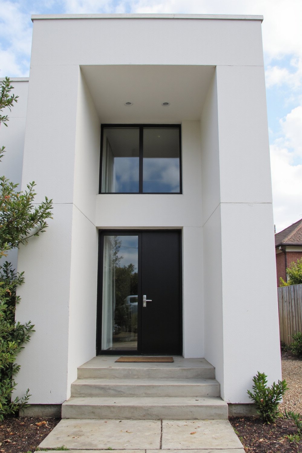 Modern house exteriors - Modern Minimalist House: Striking Double-Height Entryway - Modern minimalist house exterior design. I love the...