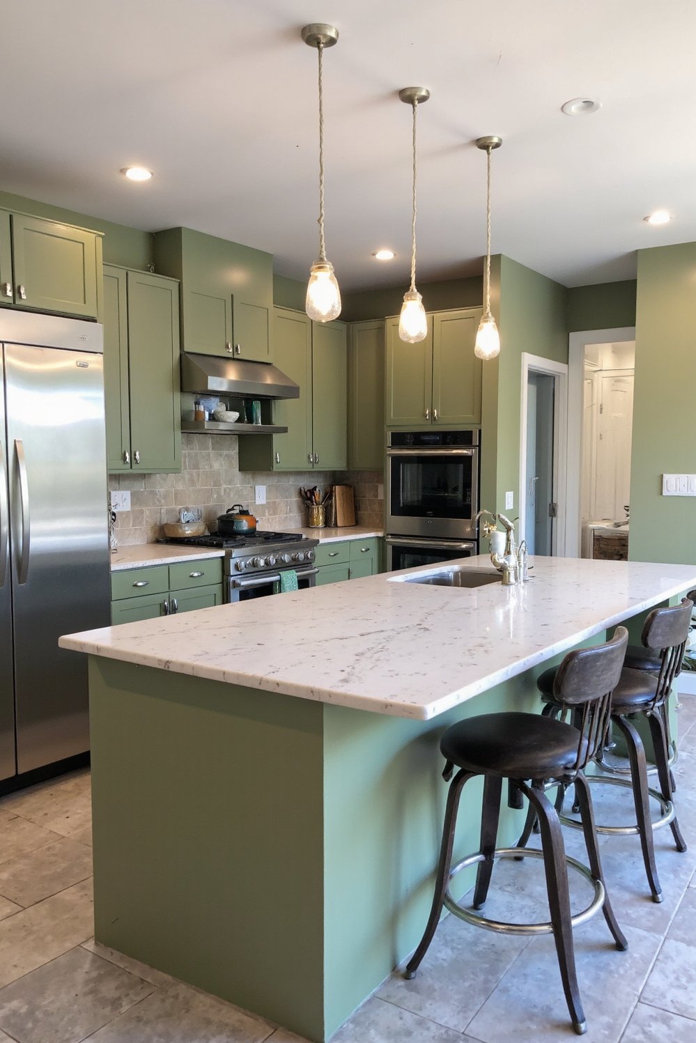 Sage Green Home Decor Ideas - Modern Kitchen with Sage Green Walls & Island - Sage green kitchen: modern and luxurious. The stainless...