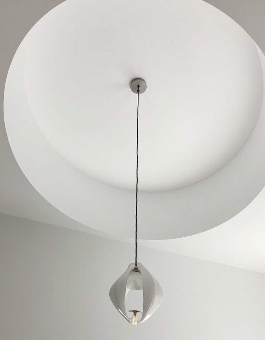 Innovative contemporary ceiling design - Crisp White Ceiling with Dramatic Pendant Light - A modern, minimalist ceiling design. Clean white lines...