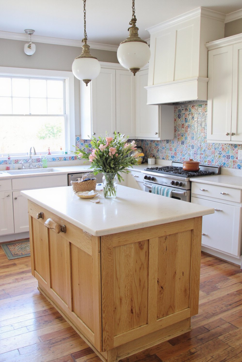 Wood kitchen island ideas - Rustic Farmhouse Kitchen Island with Tile Backsplash - Farmhouse kitchen island with a patterned tile backsplash....
