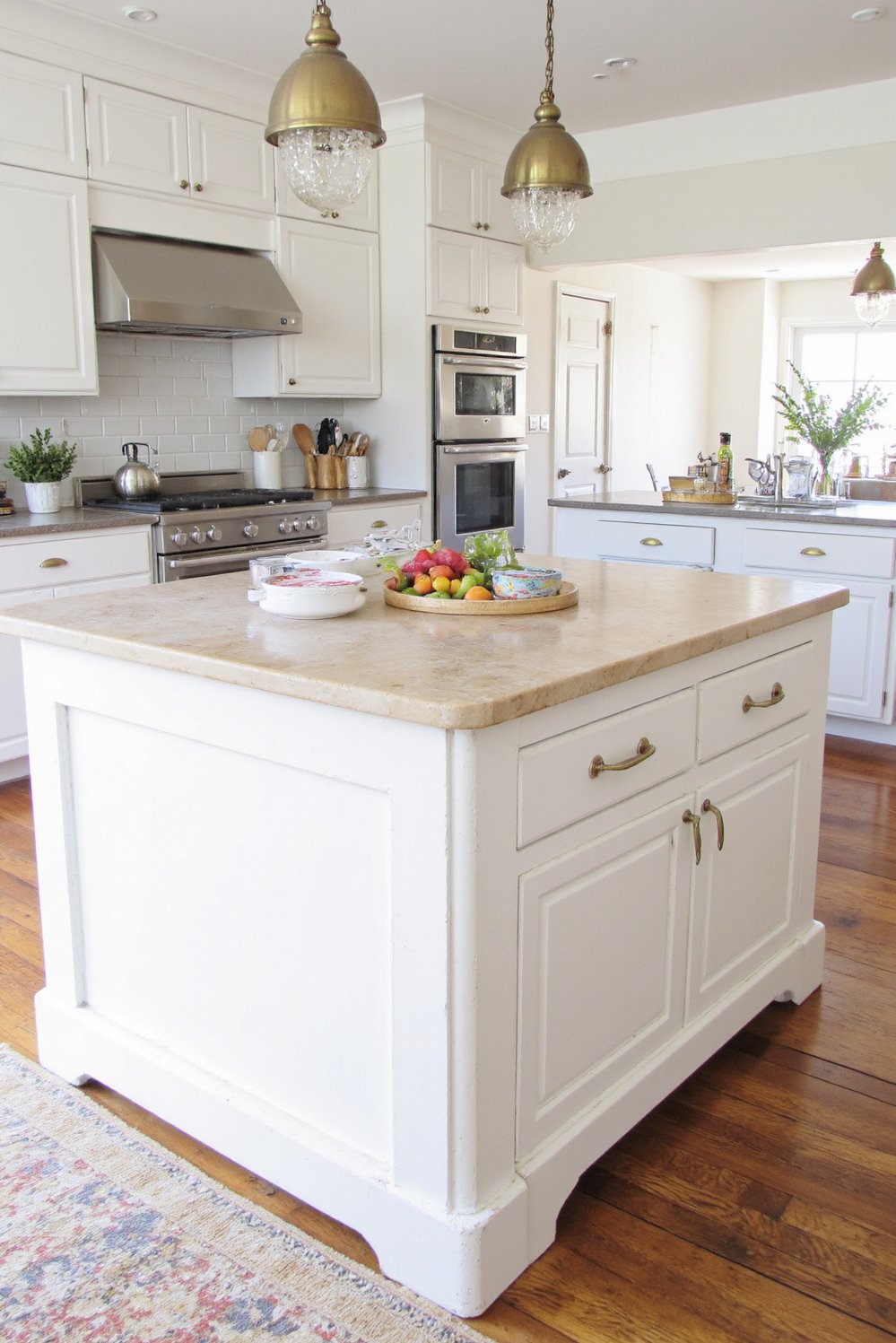 Wood kitchen island ideas - Distressed White Farmhouse Island with Soapstone Top - Simple farmhouse kitchen island with a gorgeous distressed...
