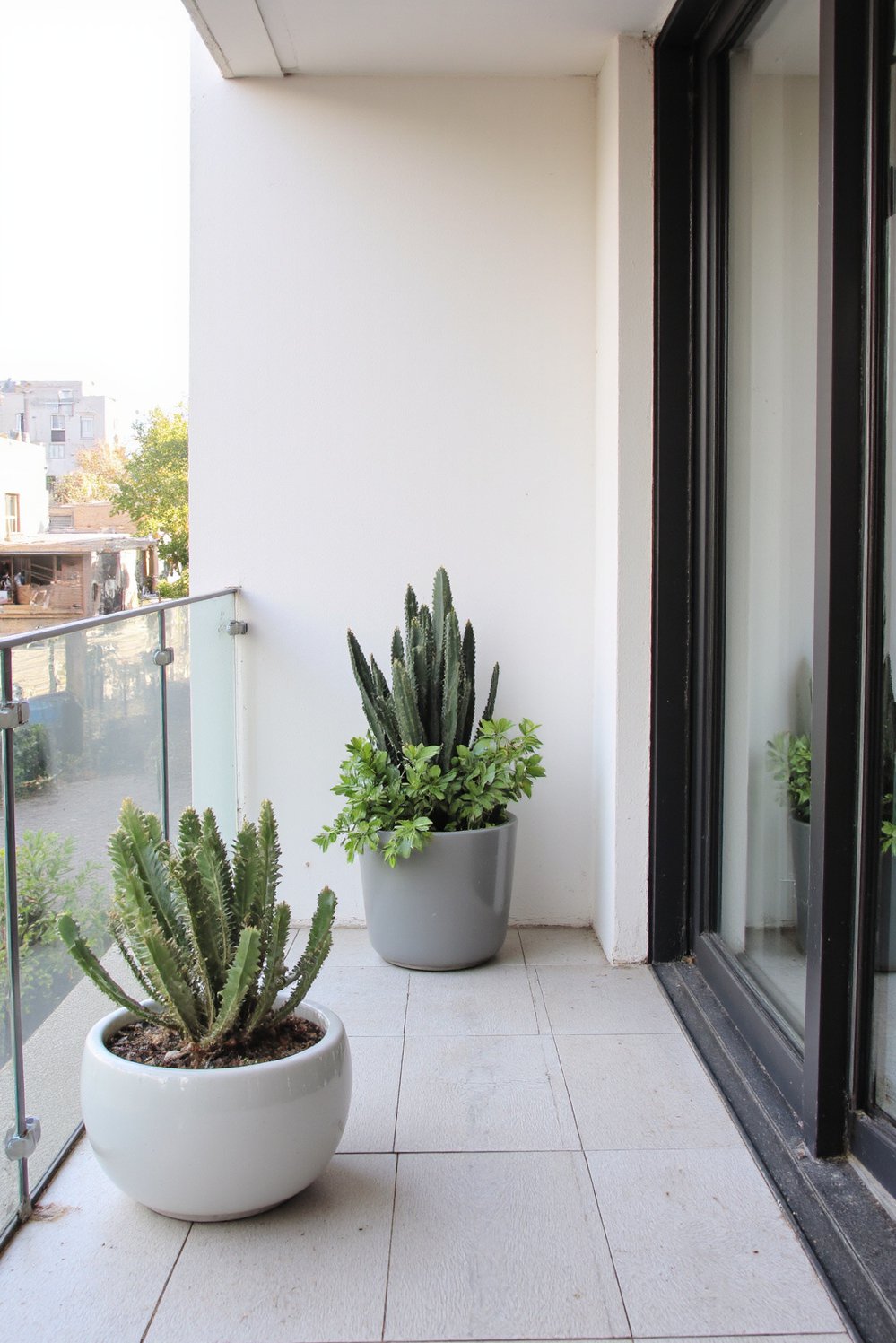 Balcony flooring ideas - Modern Balcony: Wood-Grain Porcelain Balcony Flooring - Update your balcony with large, light grey porcelain...