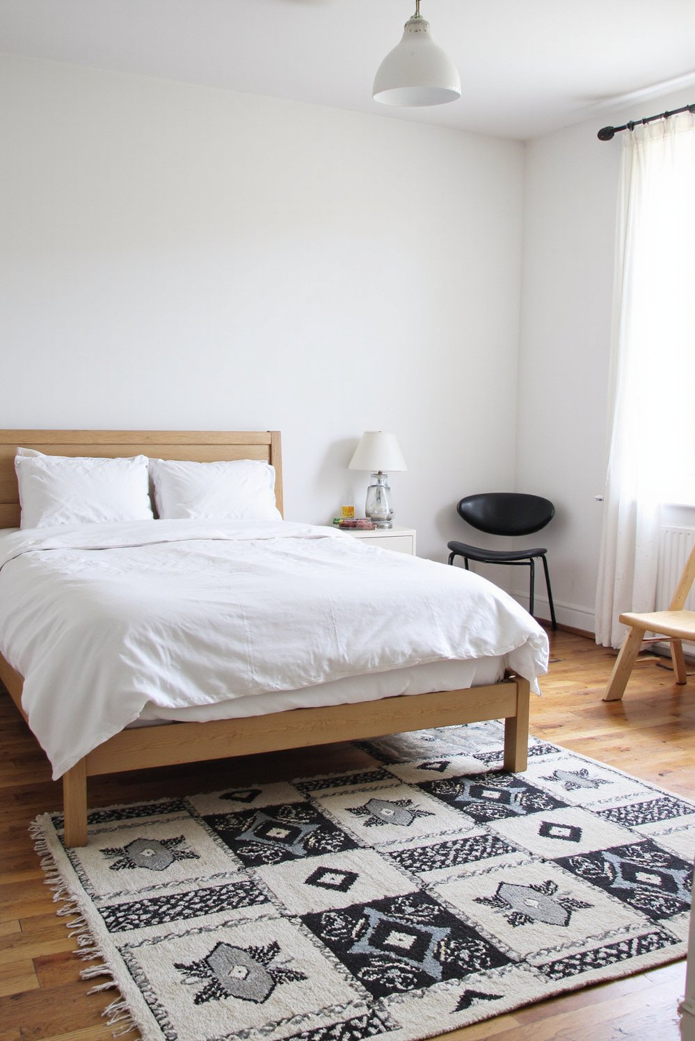 Scandinavian bedroom ideas - Geometric Rug: Modern Scandinavian Bedroom Design - Scandinavian bedroom design with a geometric rug. A...