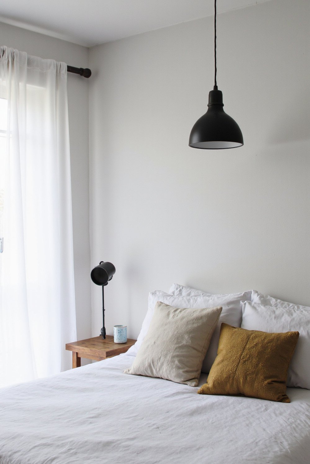 Scandinavian bedroom ideas - Sleek Modern Scandinavian Bedroom with Pendant Lamp - Scandinavian bedroom design often features simple lines and...