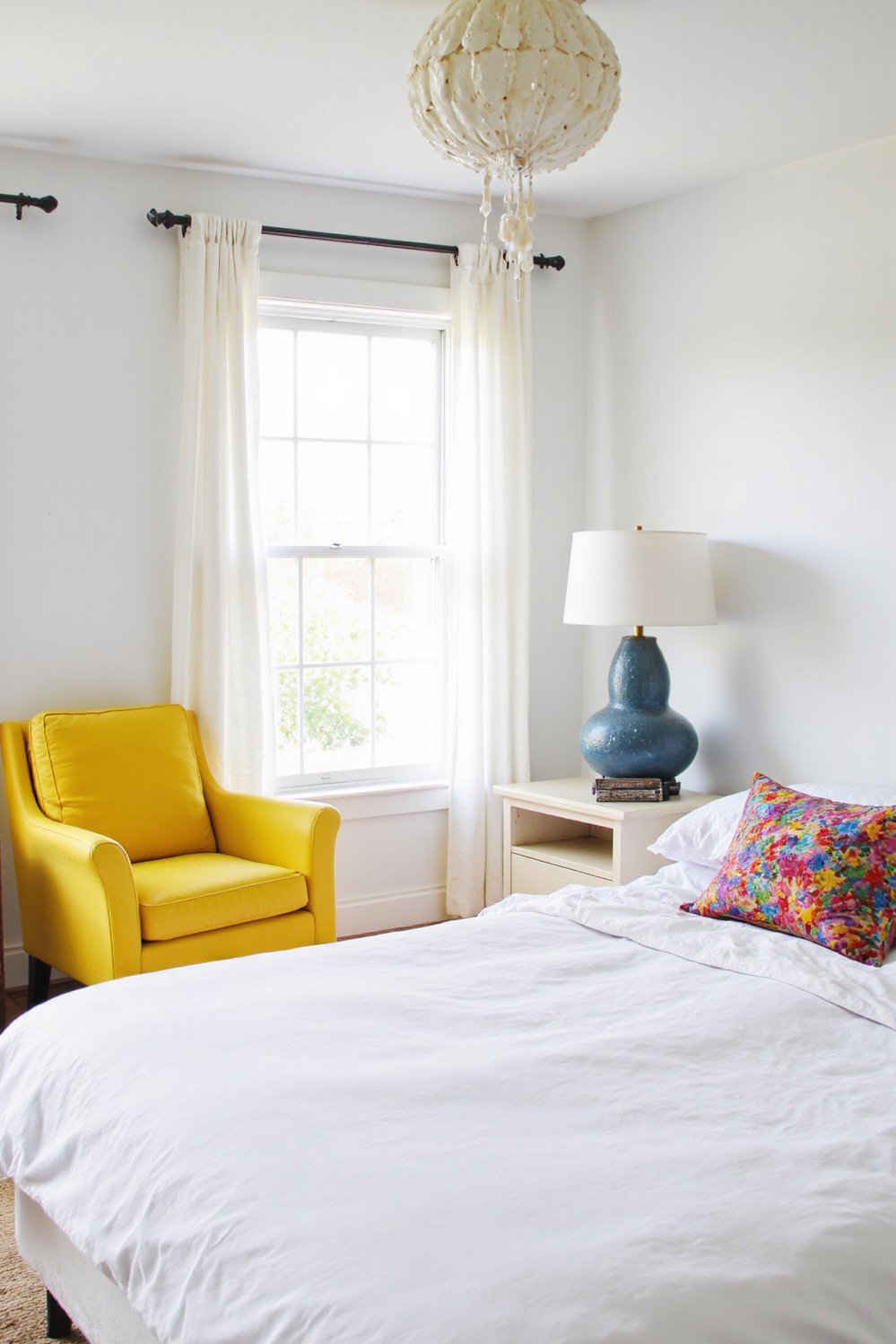 Scandinavian bedroom ideas - Scandi Bedroom with Yellow Accent Chair & Pillows - Scandinavian bedroom with a pop of color: This...