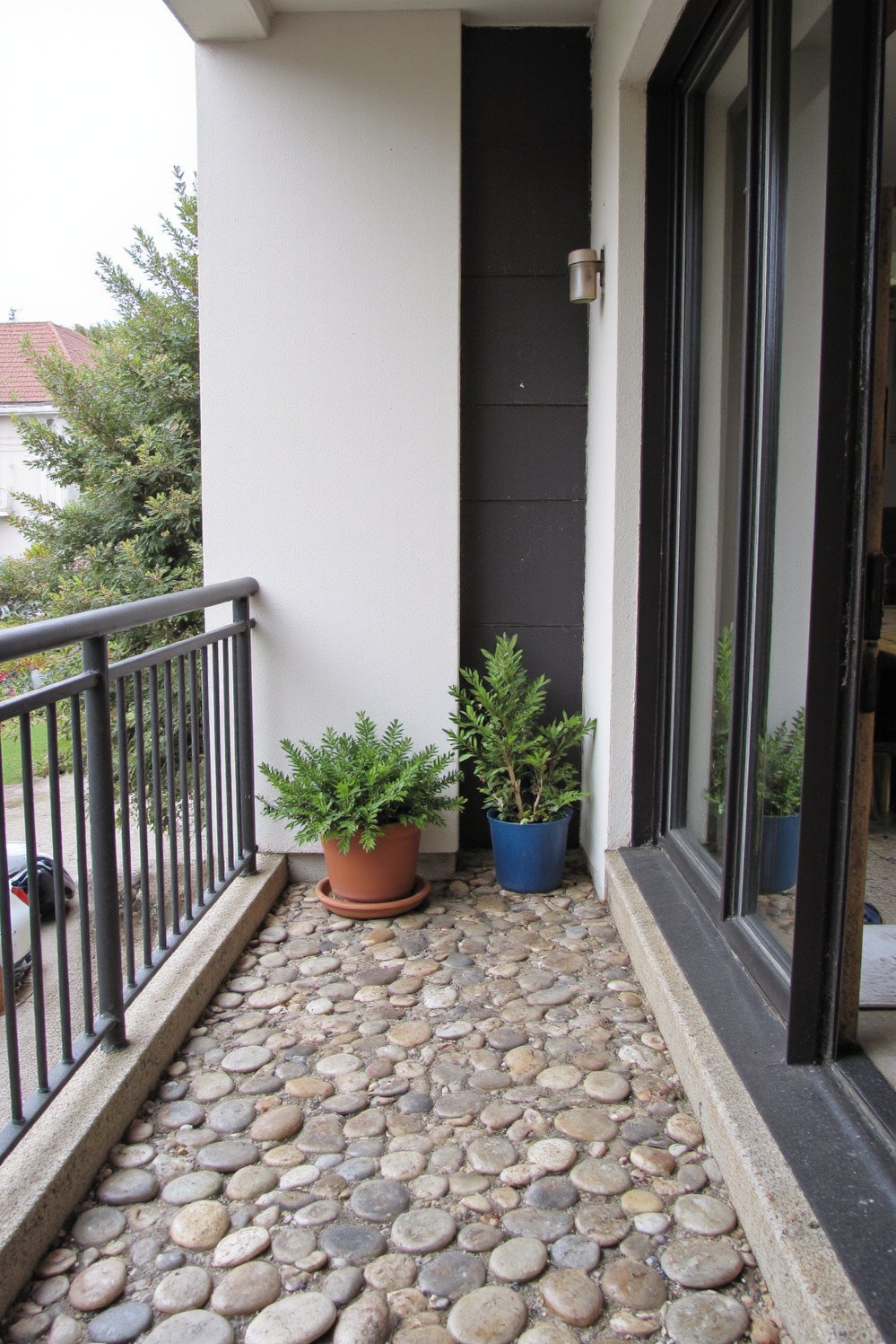 Balcony flooring ideas - Serene Balcony: River Stone Flooring Ideas - Give your small balcony a spa-like feel with...