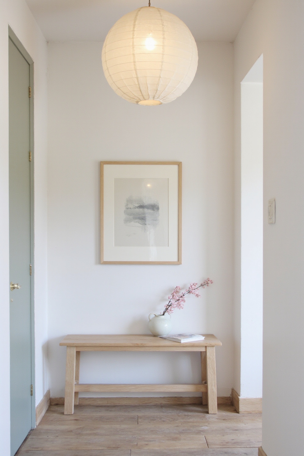 end of hallway decor - A Serene Welcome At Hallway's End - Gentle, diffused light spills from a large paper...