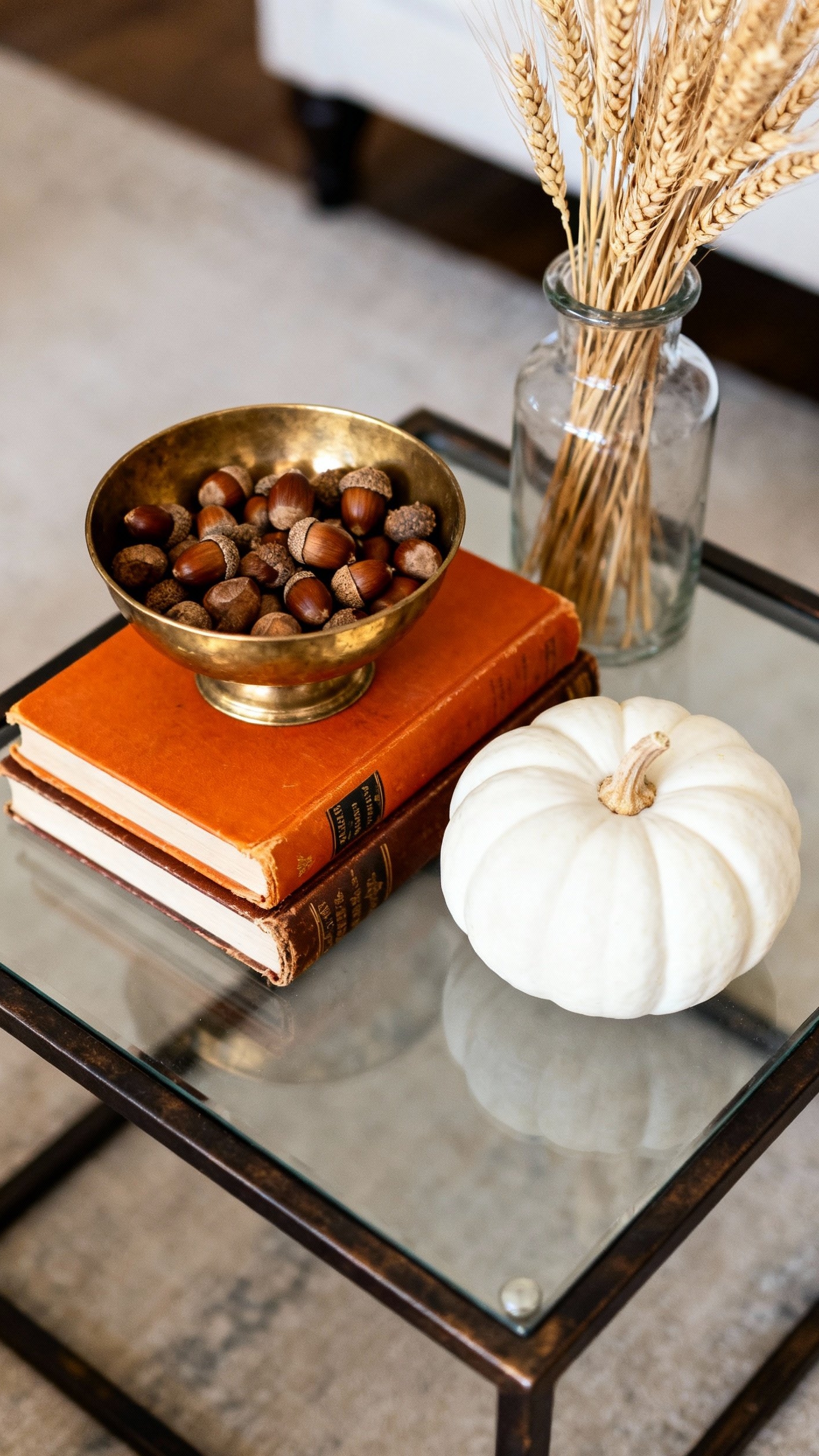 living room modern fall decor ideas - Fall Flair: Modern Living Room Style - A dark metal and glass coffee table showcases...