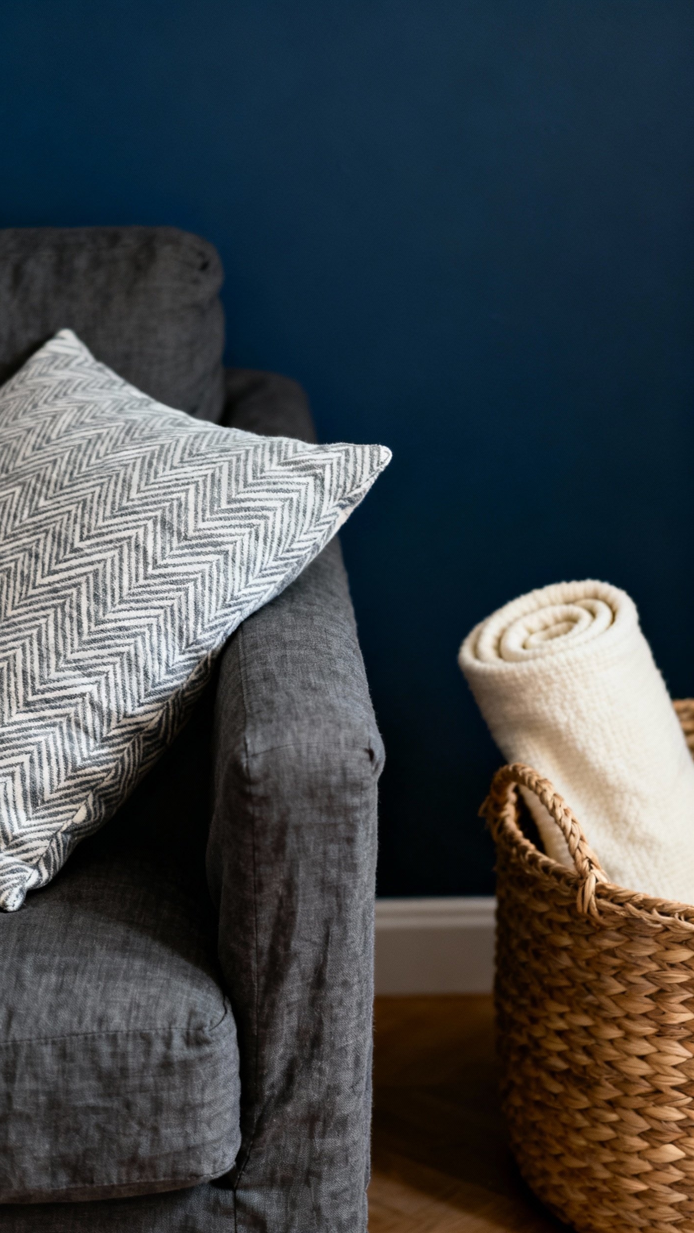 Dark Grey Couch Styling - Dark Grey Couch: Styling Secrets - Deep navy walls create a striking backdrop for...