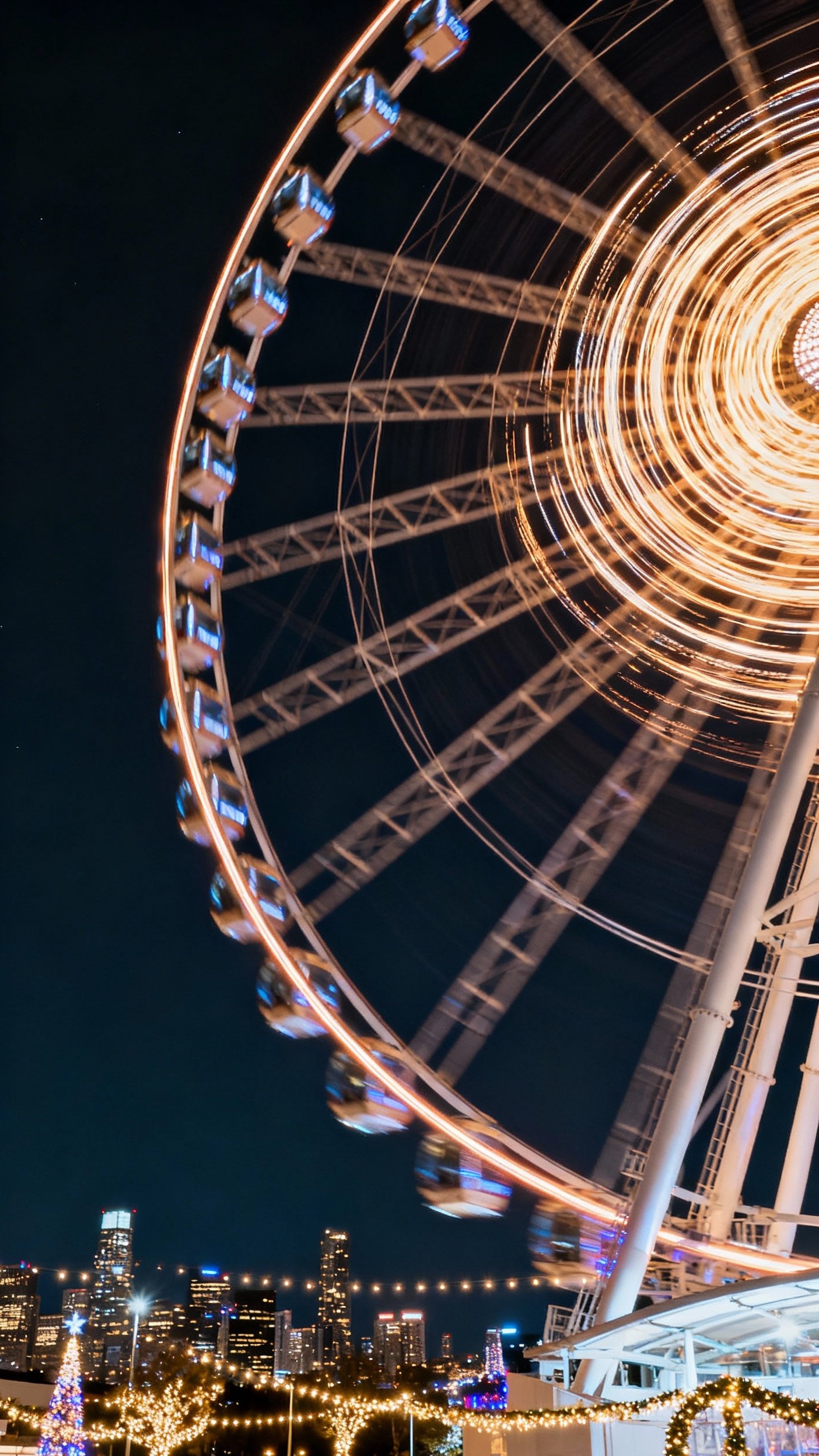 Urban City Photography - City Lights: Capturing Urban Energy - The Ferris wheel spins, painting vibrant streaks of...