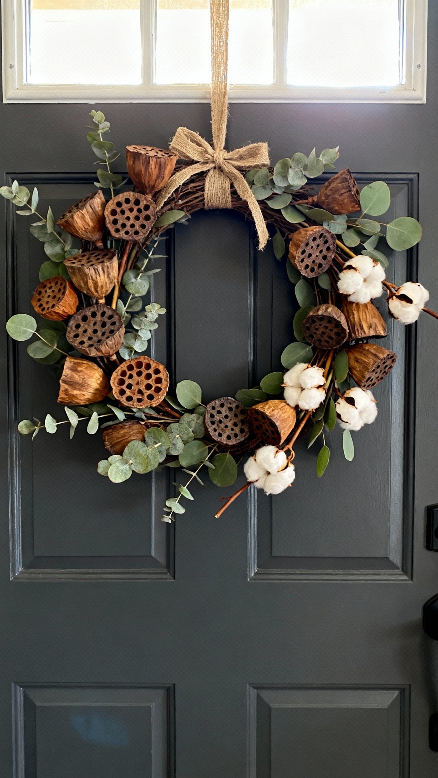 fall wreaths - Natural Fall Wreaths for Your Door - A dark gray front door welcomes visitors with...