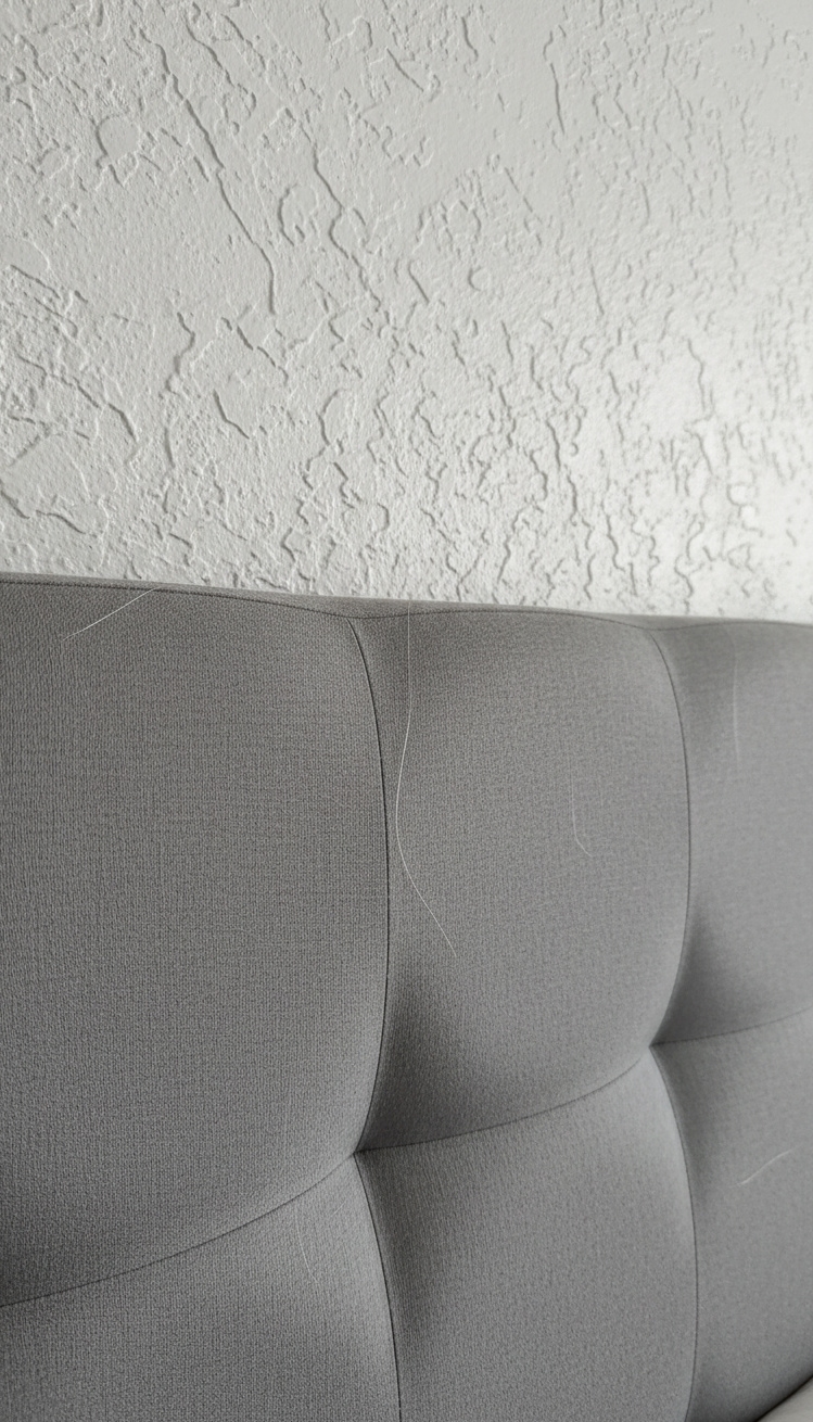 white and gray bedroom - Soft Textures Anchor White and Gray - The gray headboard anchors this bedroom, its soft...