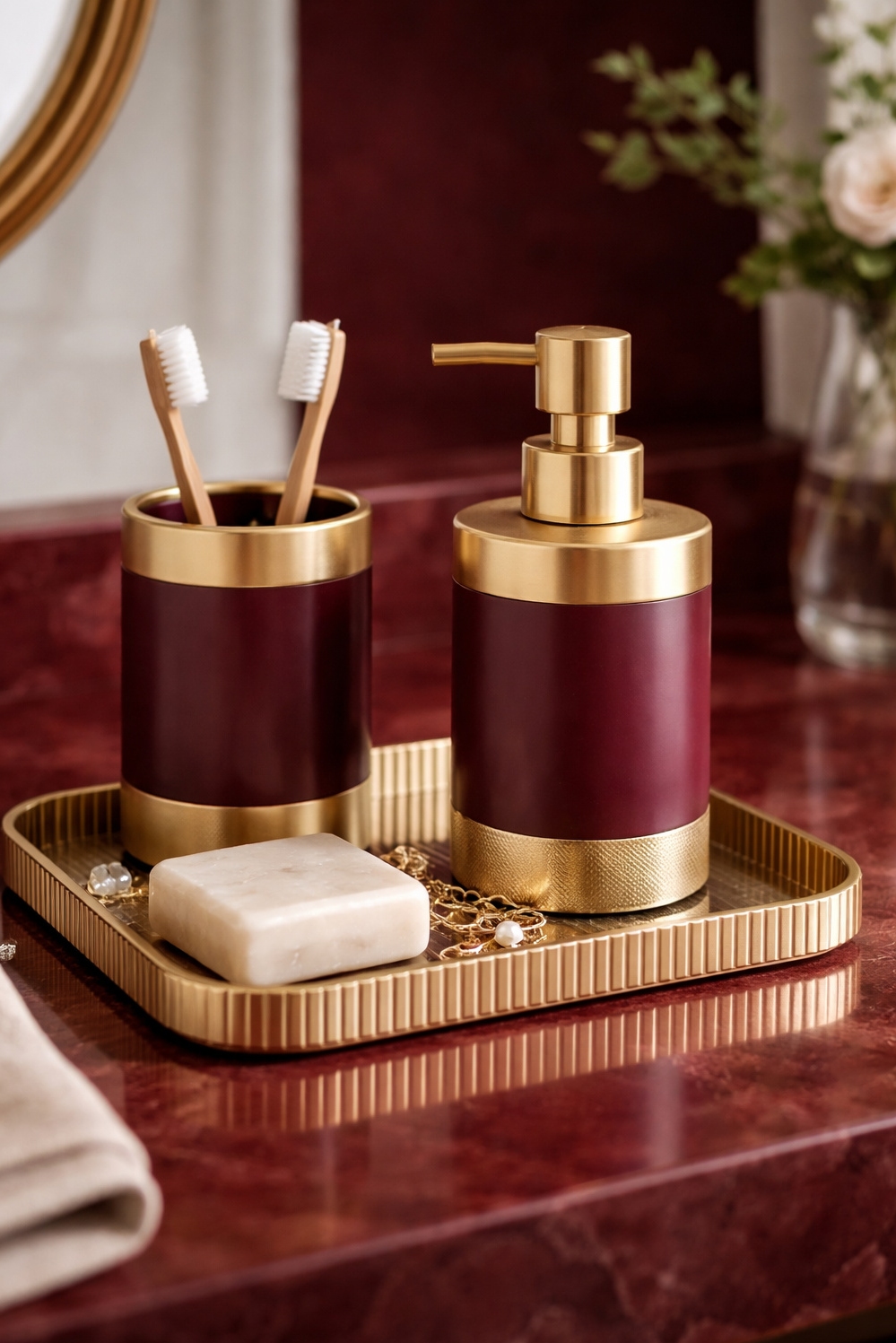 Burgundy and gold bathroom design ideas - Gold Accessories Glow Against Deep Burgundy - These gold accessories practically glow against the deep...