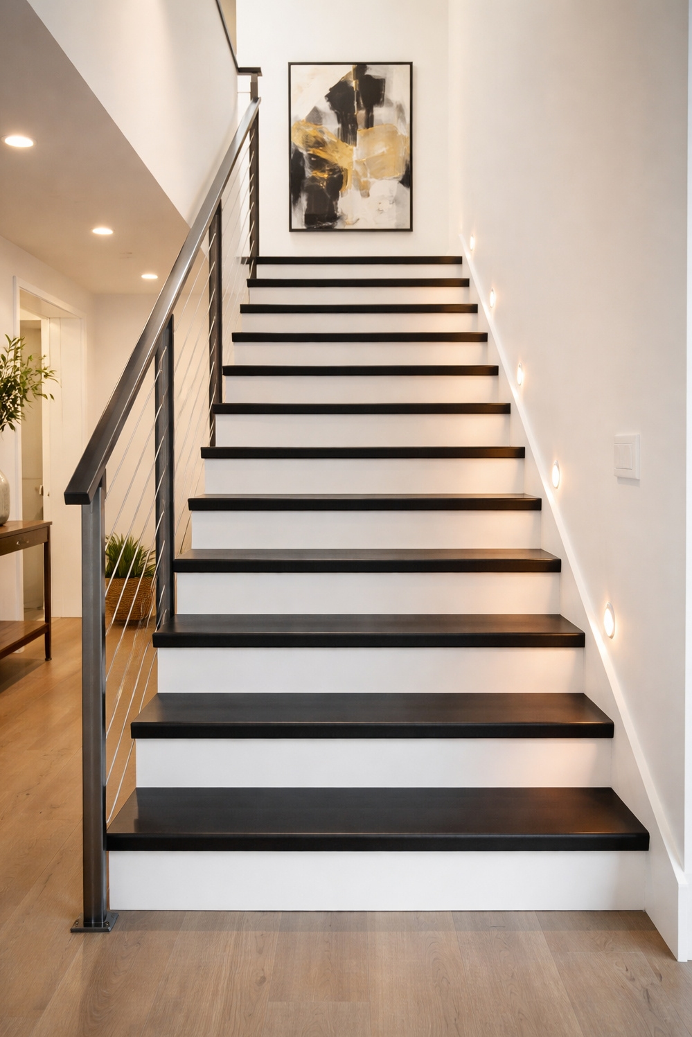 Black painted stair treads ideas - Striking Black Treads: Light Bounces Up - These black painted stair treads offer a striking...